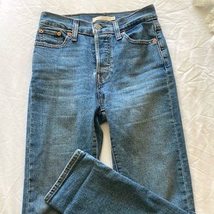 Levi’s straight leg jeans. Medium-wash denim, high-waisted with buttons. Size 24